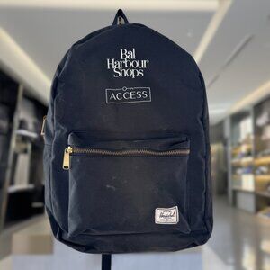 Black Herschel Supply Co. Backpack with "Bal Harbour Shops ACCESS" branding